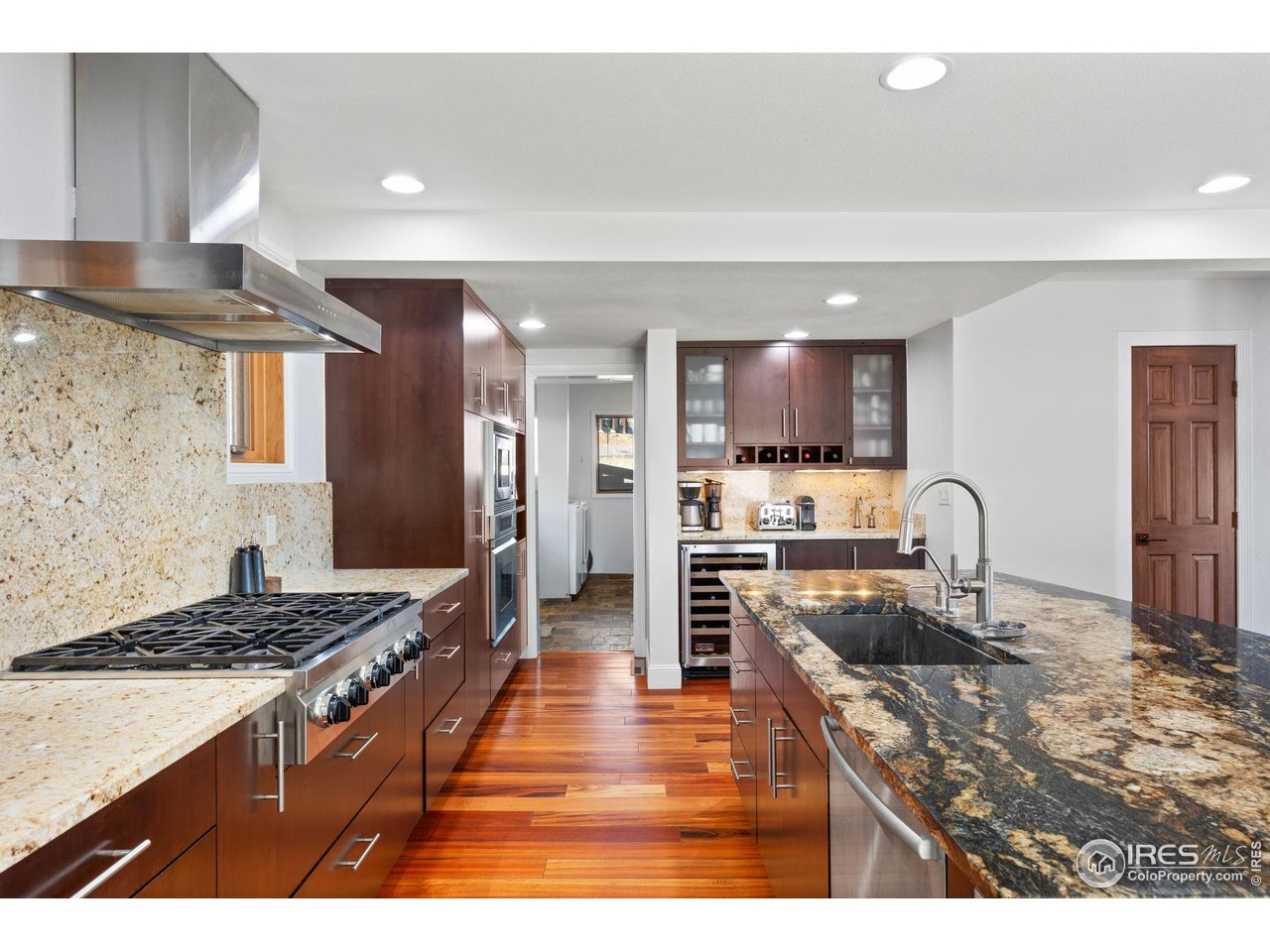 8543 Middle Fork Road Boulder, CO 80302 - Photo 20 of 48 a kitchen with stainless steel appliances granite countertop a stove refrigerator sink and cabinets