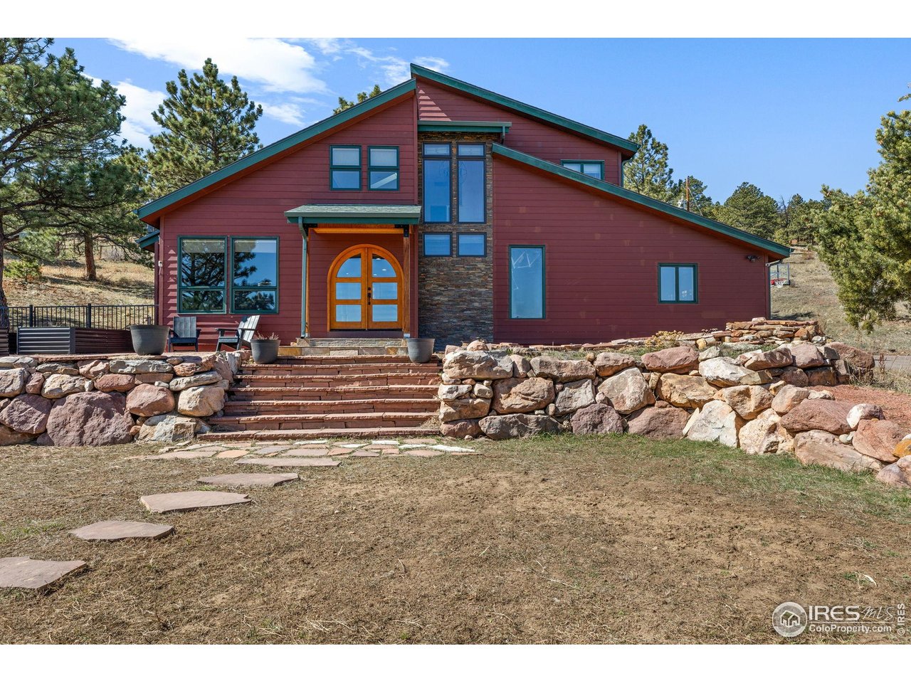 8543 Middle Fork Road Boulder, CO 80302 - Photo 2 of 48 a front view of a house with a yard