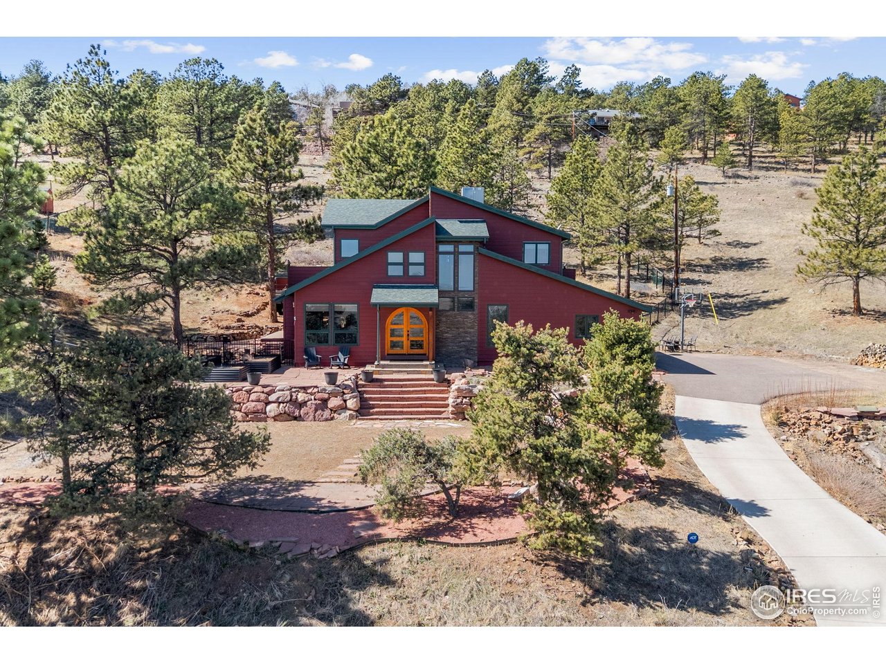 8543 Middle Fork Road Boulder, CO 80302 - Photo 3 of 48 a view of a house with a yard