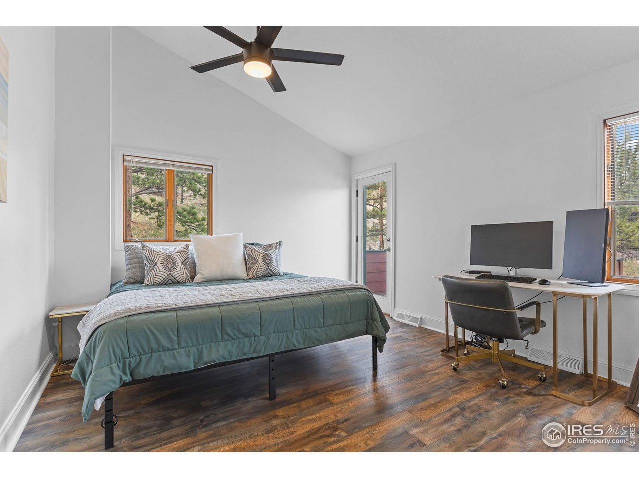 8543 Middle Fork Road Boulder, CO 80302 - Photo 36 of 48 a bedroom with a bed and a flat screen tv
