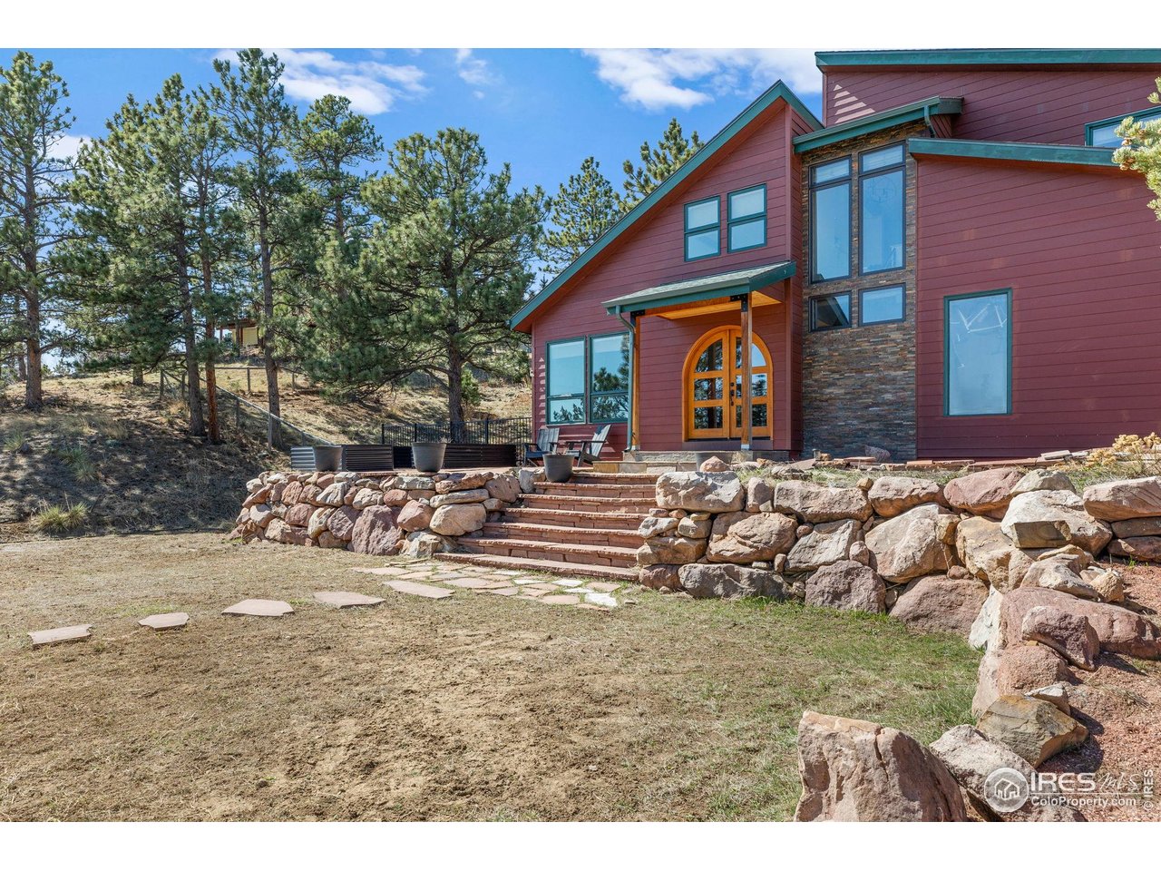 8543 Middle Fork Road Boulder, CO 80302 - Photo 4 of 48 a front view of a house with a yard