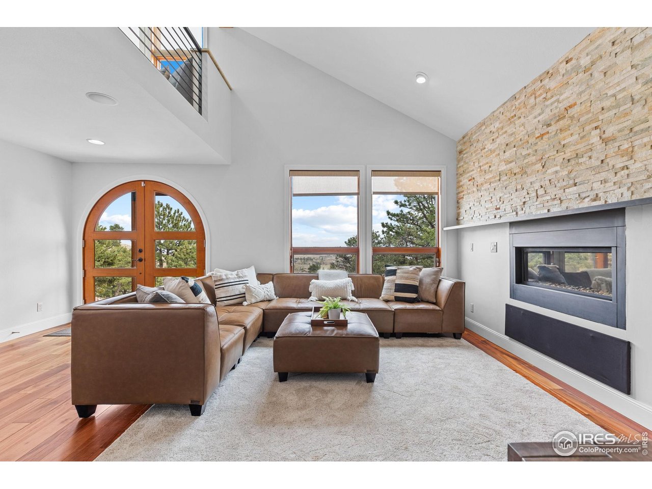8543 Middle Fork Road Boulder, CO 80302 - Photo 6 of 48 a living room with furniture and a large window