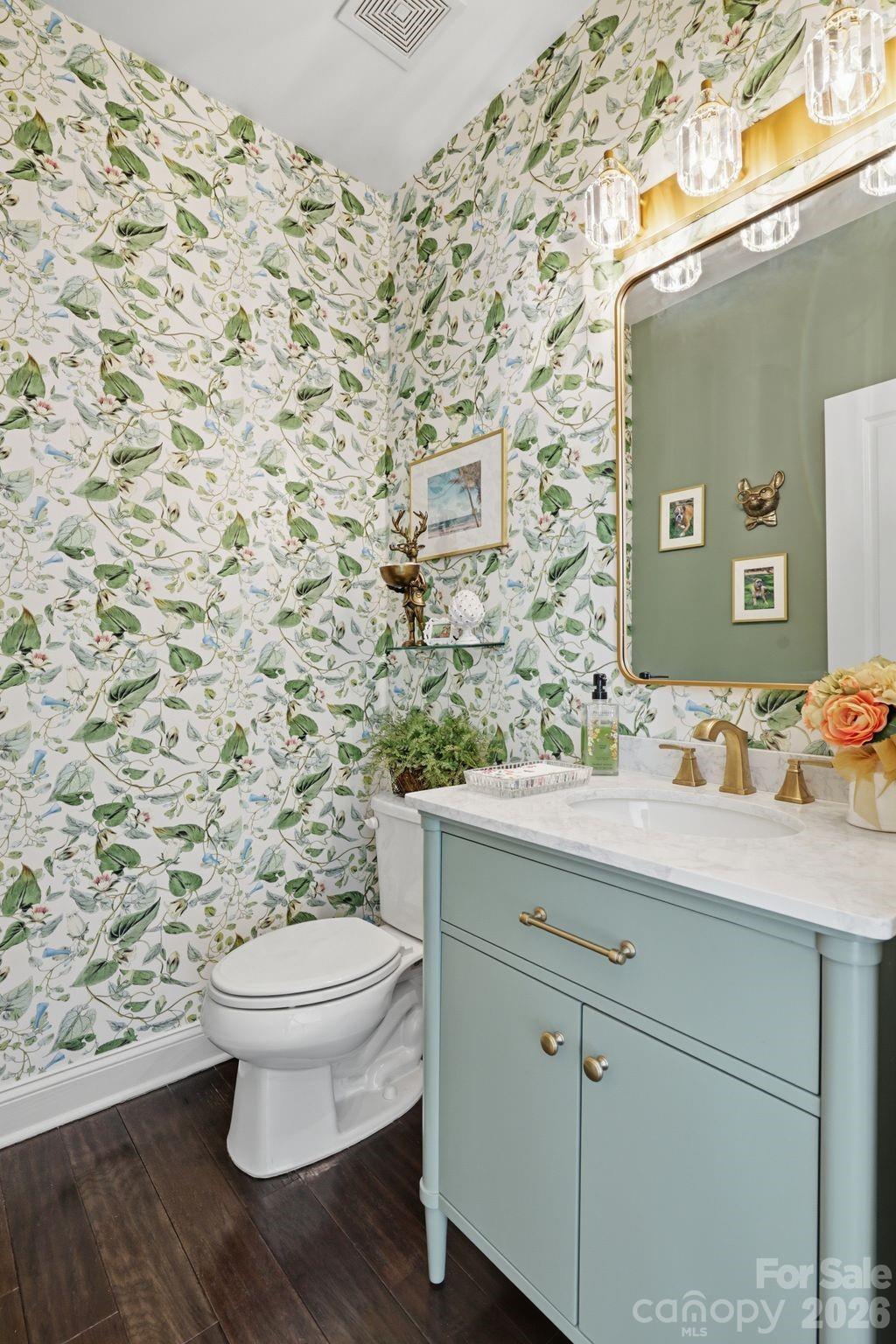 215 Streamwood Road Troutman, NC 28166 - Photo 11 of 48 a bathroom with a granite countertop toilet sink and mirror