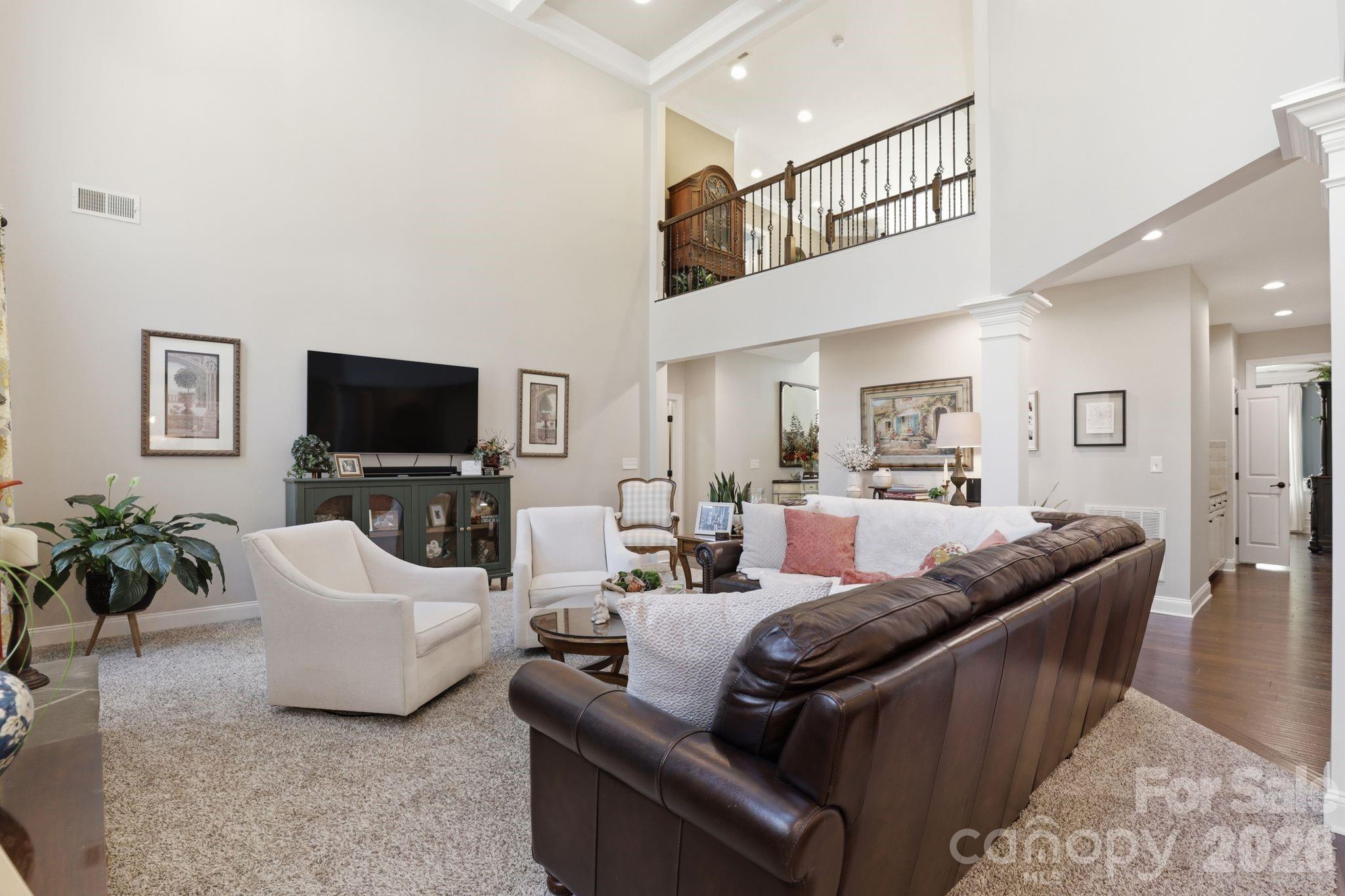 215 Streamwood Road Troutman, NC 28166 - Photo 15 of 48 a living room with furniture and a flat screen tv