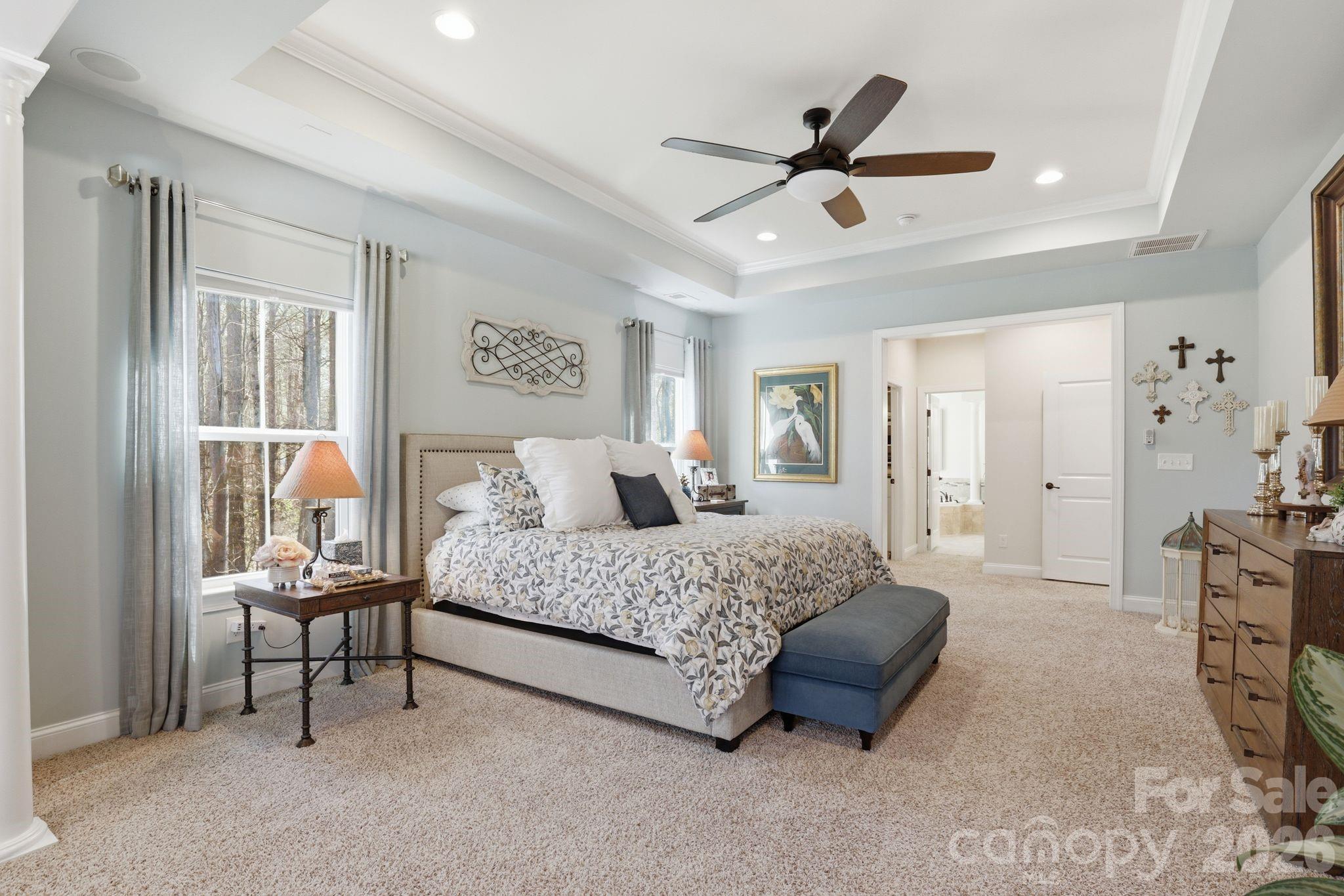 215 Streamwood Road Troutman, NC 28166 - Photo 23 of 48 a spacious bedroom with a bed and a window