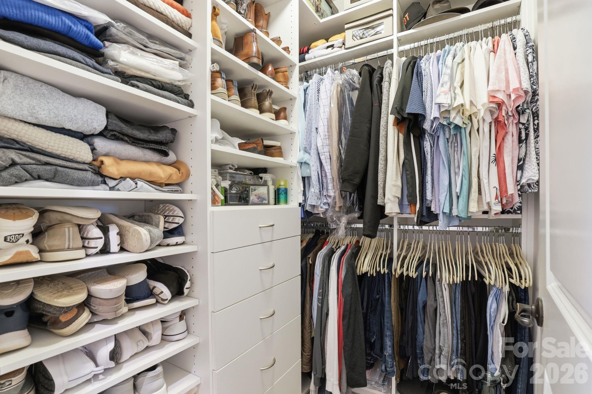 215 Streamwood Road Troutman, NC 28166 - Photo 25 of 48 a view of walk in closet with clothes and shoes