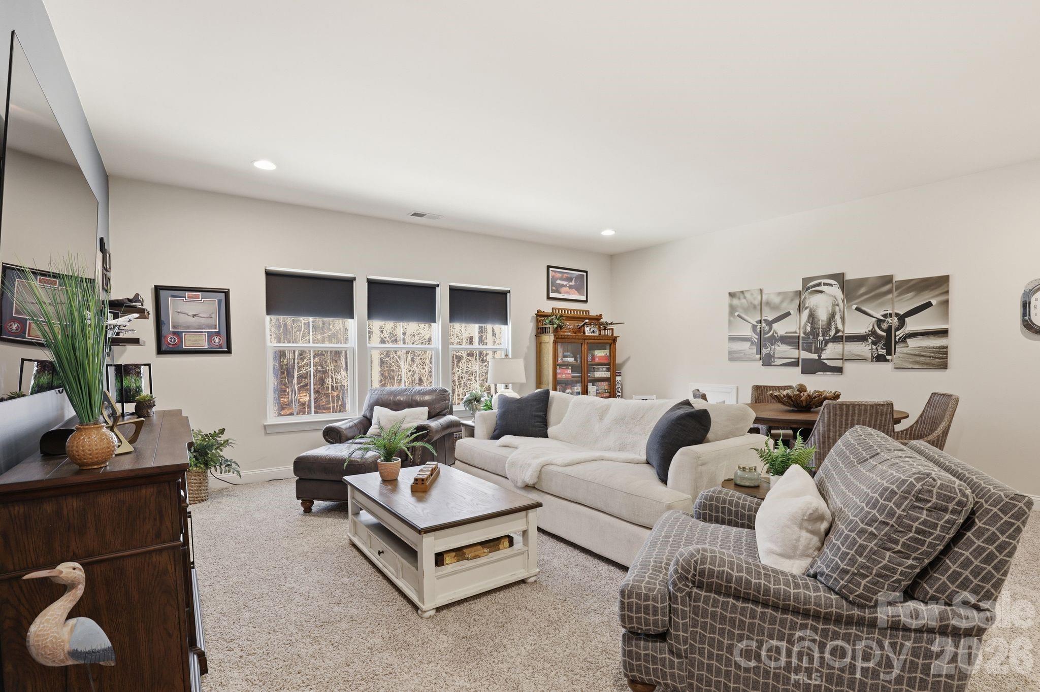 215 Streamwood Road Troutman, NC 28166 - Photo 29 of 48 a living room with furniture rug and lamp