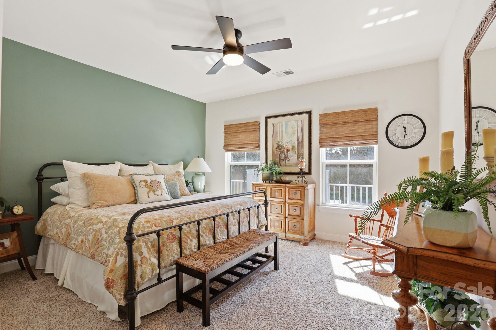 215 Streamwood Road Troutman, NC 28166 - Photo 32 of 48 a living room with a bed furniture and a large window