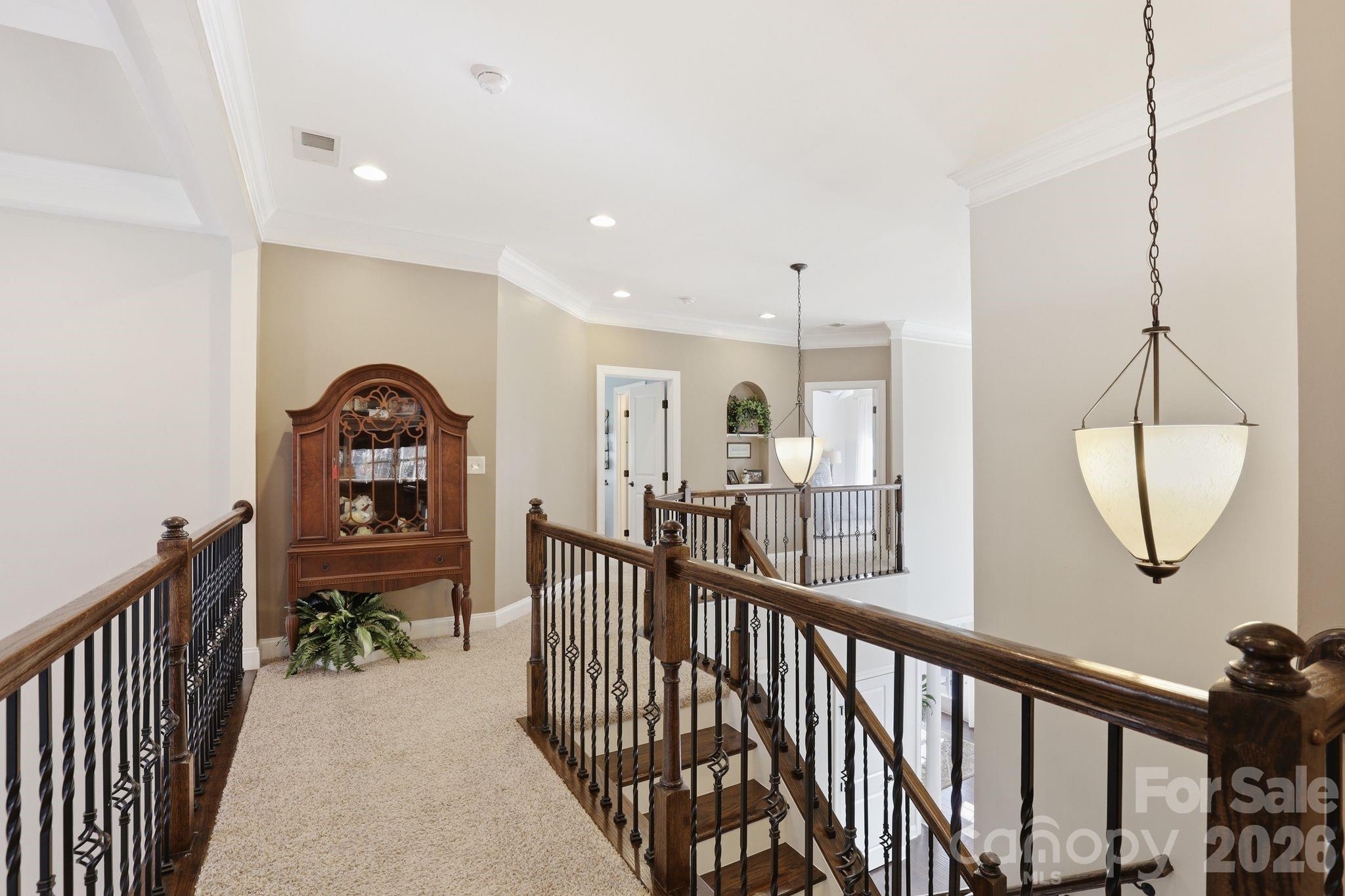 215 Streamwood Road Troutman, NC 28166 - Photo 34 of 48 a view of a hallway with wooden floor and windows