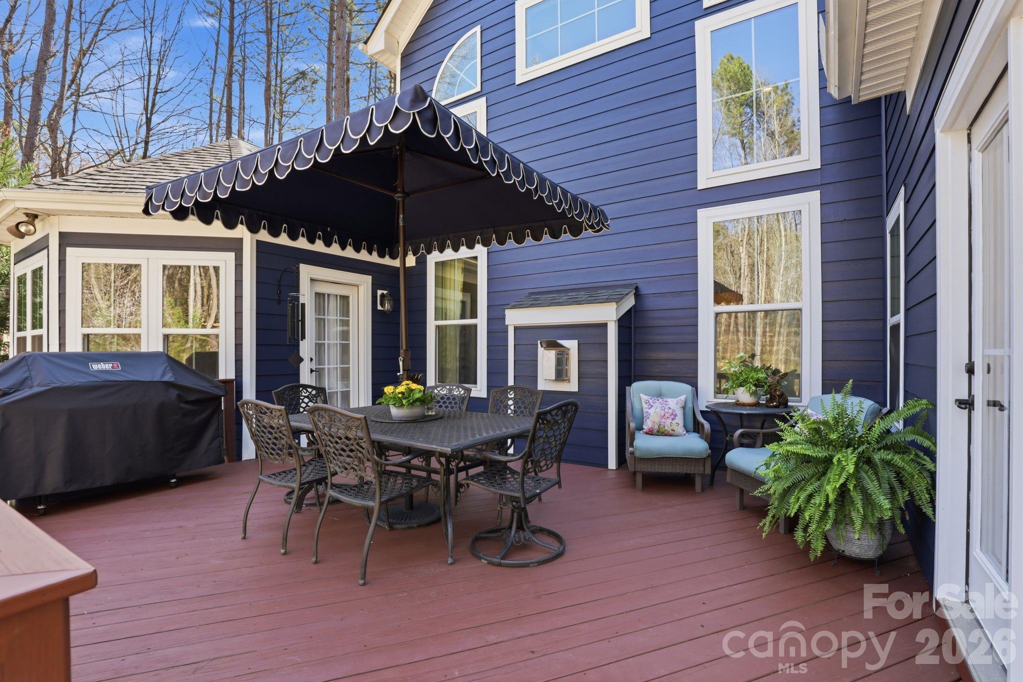 215 Streamwood Road Troutman, NC 28166 - Photo 39 of 48 a table and chairs in front of a house
