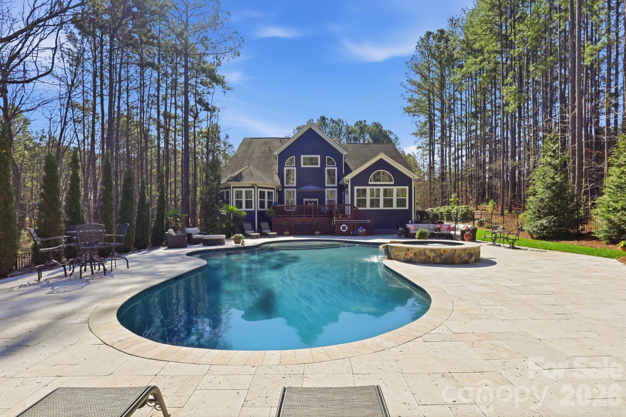 215 Streamwood Road Troutman, NC 28166 - Photo 40 of 48 a view of a house with swimming pool and sitting area