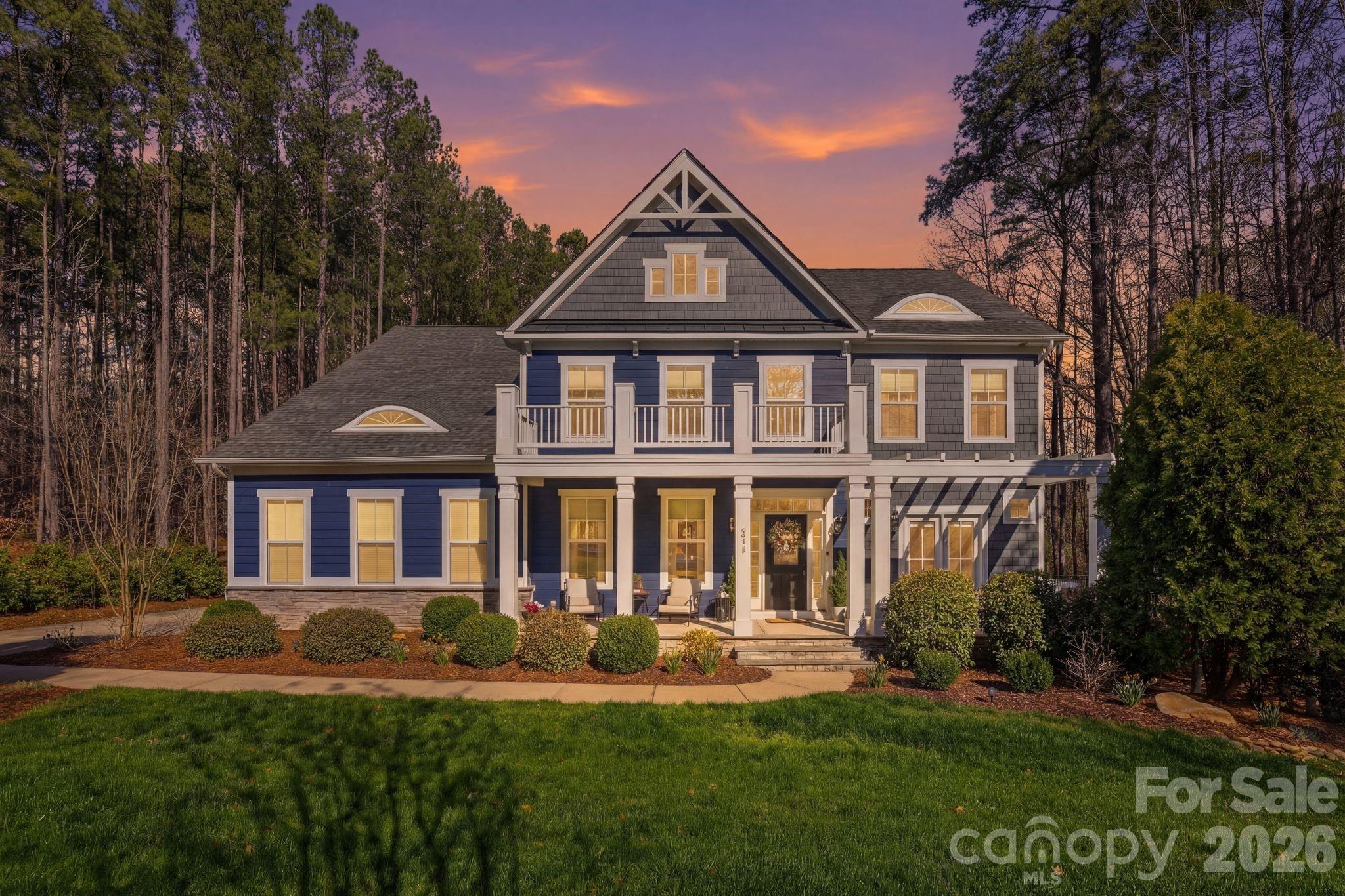 215 Streamwood Road Troutman, NC 28166 - Photo 47 of 48 a front view of a house with a garden