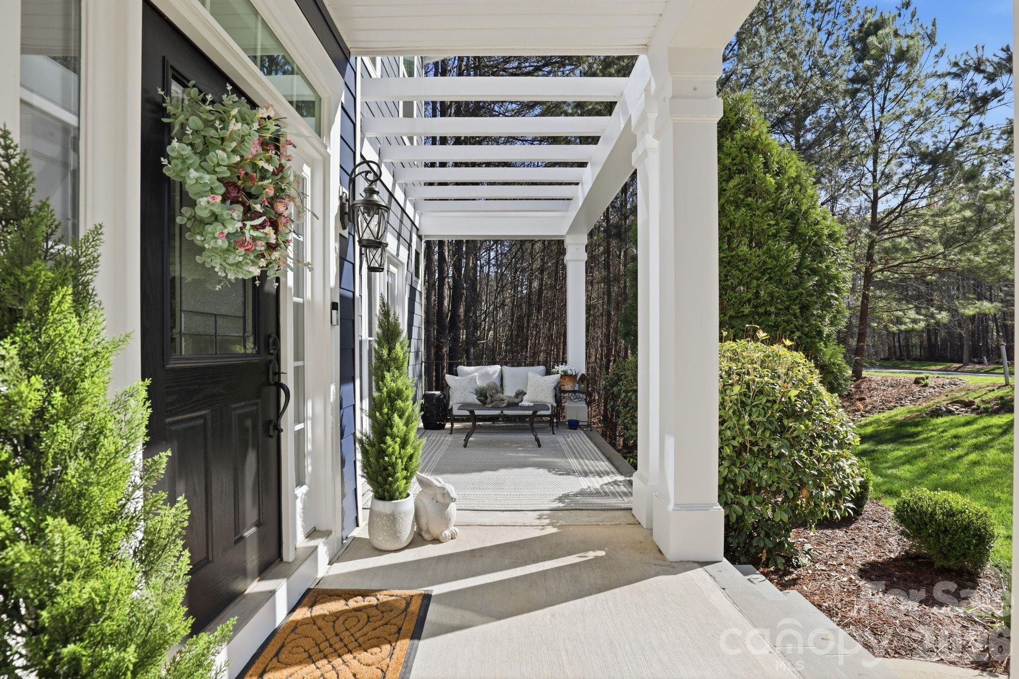 215 Streamwood Road Troutman, NC 28166 - Photo 5 of 48 a view of a porch with seating space