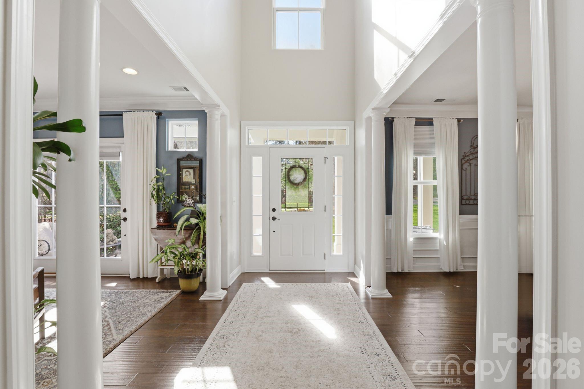 215 Streamwood Road Troutman, NC 28166 - Photo 6 of 48 a view of entryway with livingroom and wooden floor