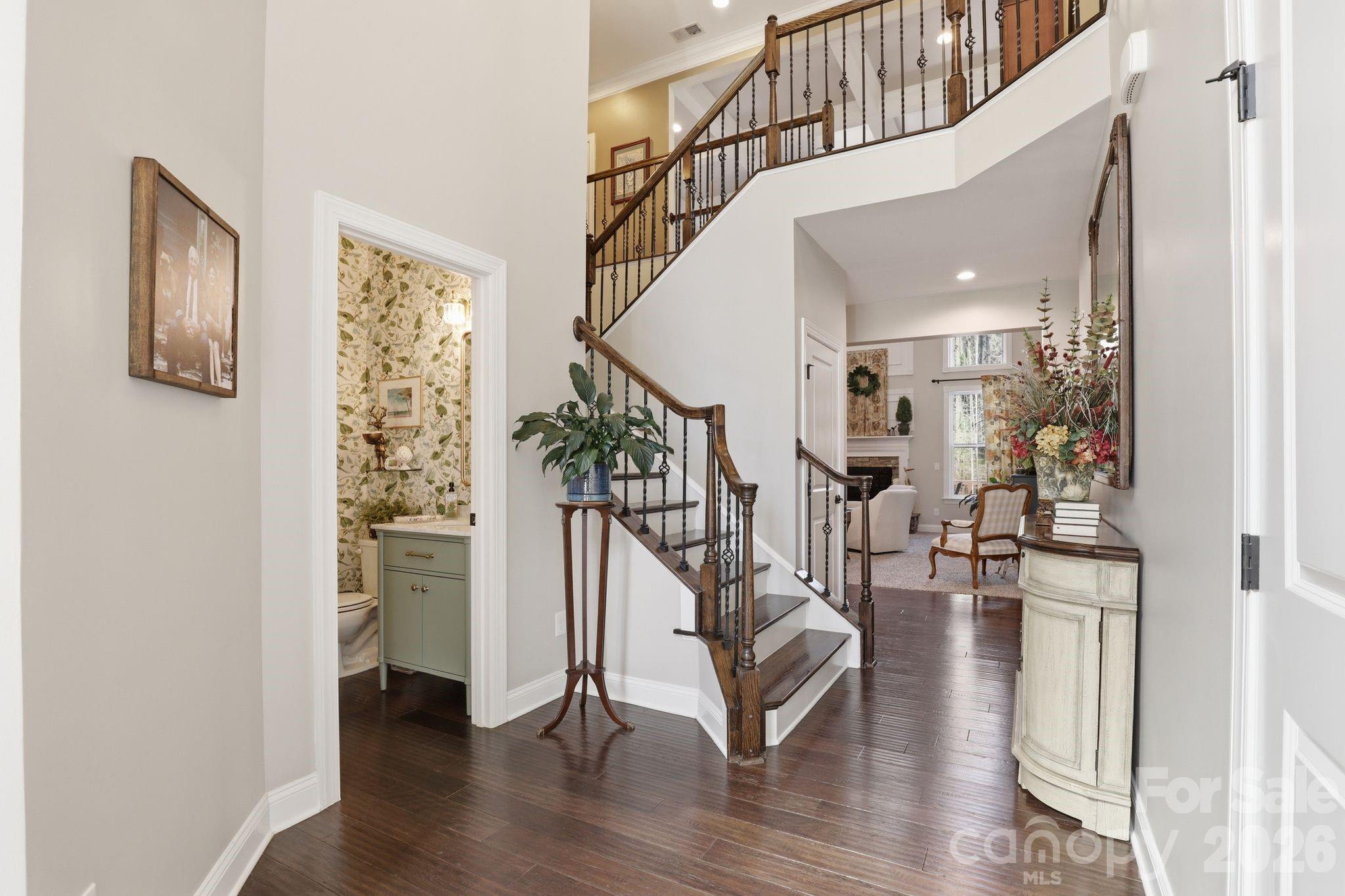 215 Streamwood Road Troutman, NC 28166 - Photo 10 of 48 a view of entryway livingroom and hall with wooden floor
