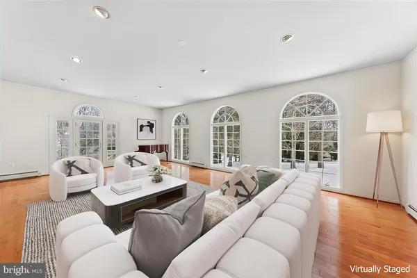 a living room with fireplace furniture and a fireplace