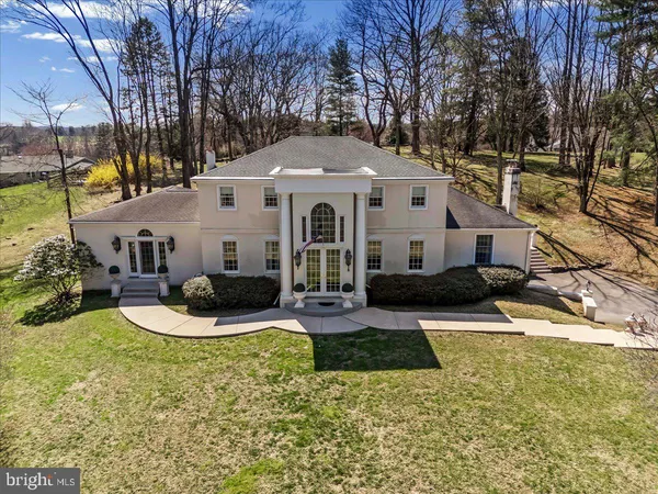 a front view of a house with a yard table and chairs