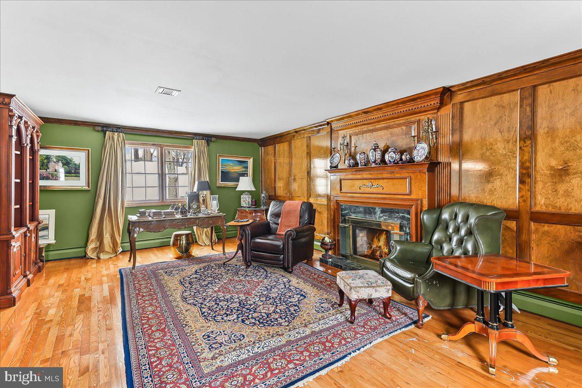 116 Deer Path Chadds Ford, PA 19317 - Photo 29 of 56 Family room with fireplace and wood accent wall