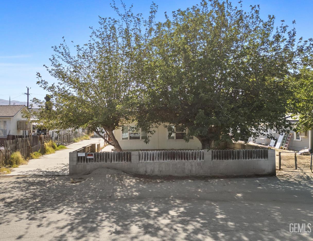 Undisclosed Address Taft, CA 93268 - Photo 2 of 8 a view of street and trees