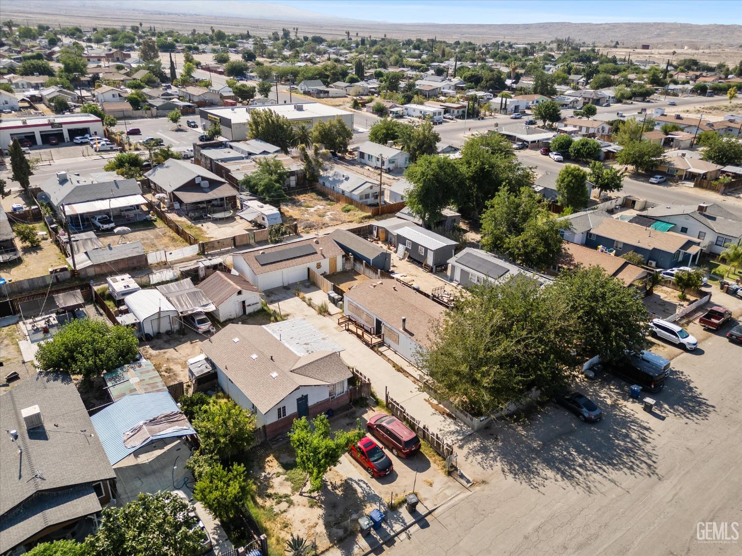 Undisclosed Address Taft, CA 93268 - Photo 6 of 8 an aerial view of residential houses with outdoor space