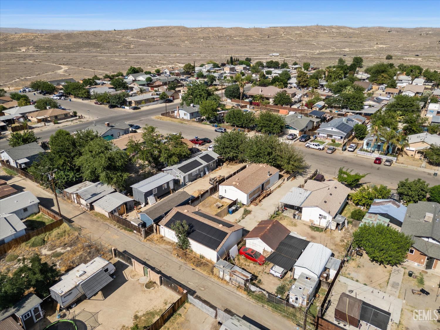 Undisclosed Address Taft, CA 93268 - Photo 7 of 8 an aerial view of a city with lots of residential buildings
