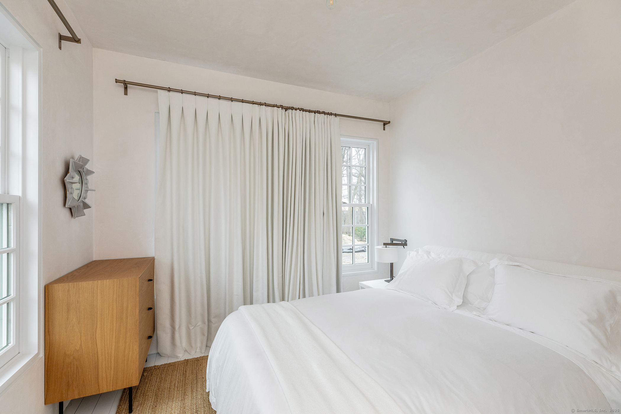 24 Old Roxbury Road Roxbury, CT 06783 - Photo 19 of 38 a bedroom with a bed and a chair