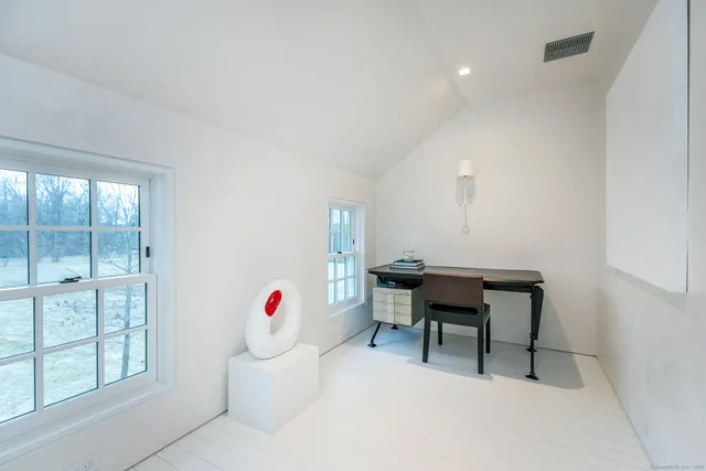 a workspace with furniture and window