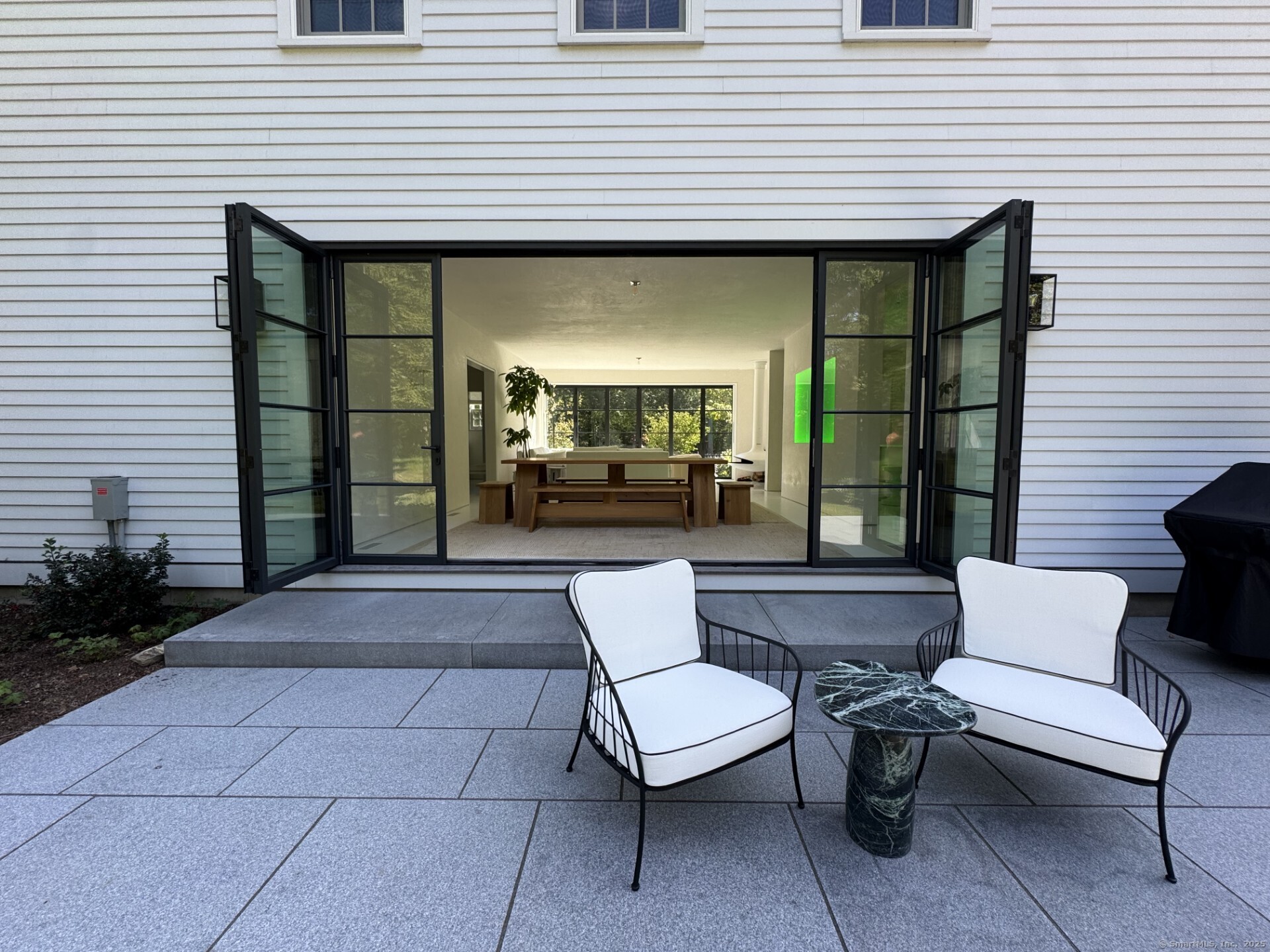 24 Old Roxbury Road Roxbury, CT 06783 - Photo 28 of 38 a view of a patio with couches table and chairs and potted plants