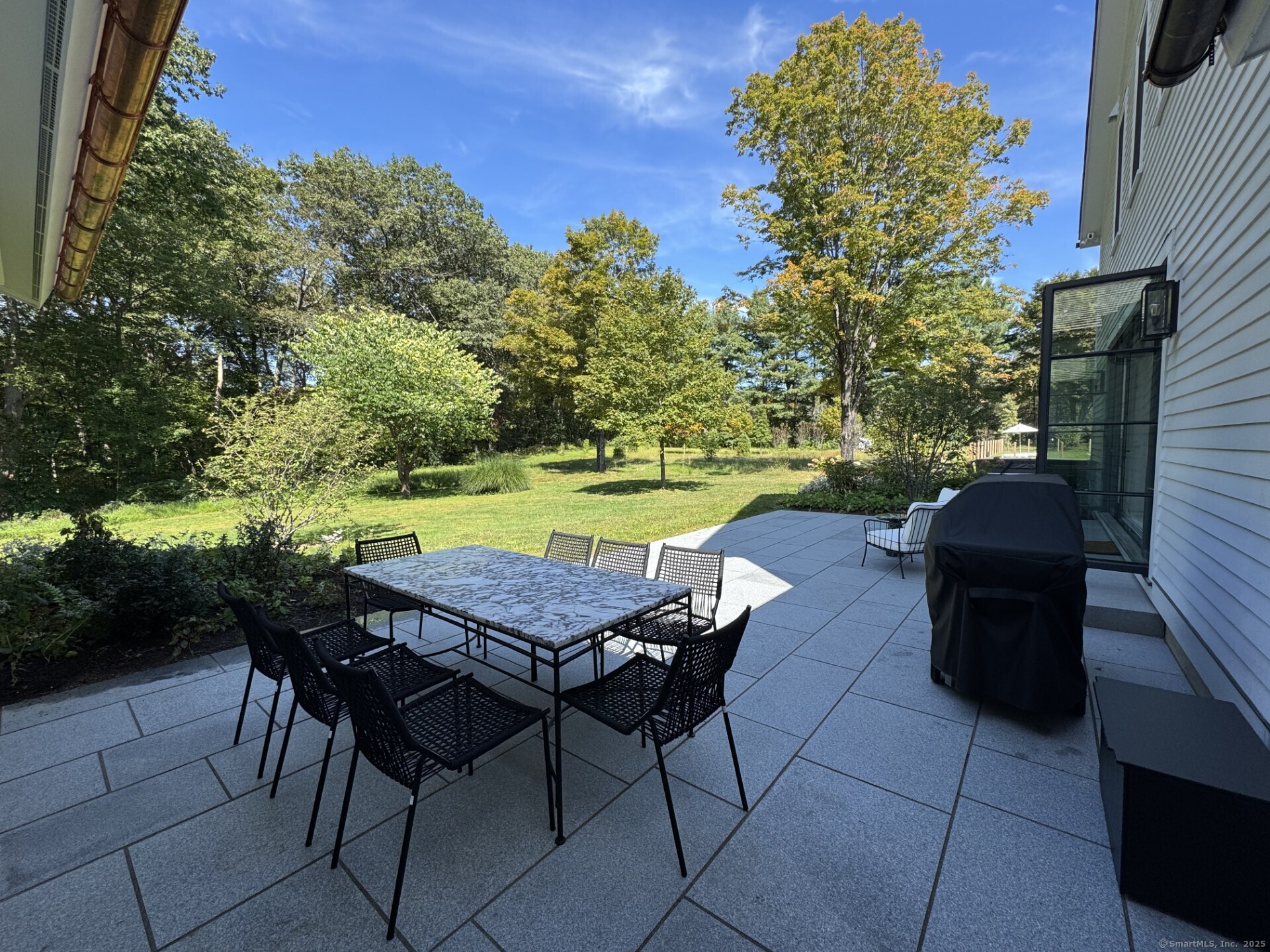 24 Old Roxbury Road Roxbury, CT 06783 - Photo 34 of 38 a patio with water table and chairs