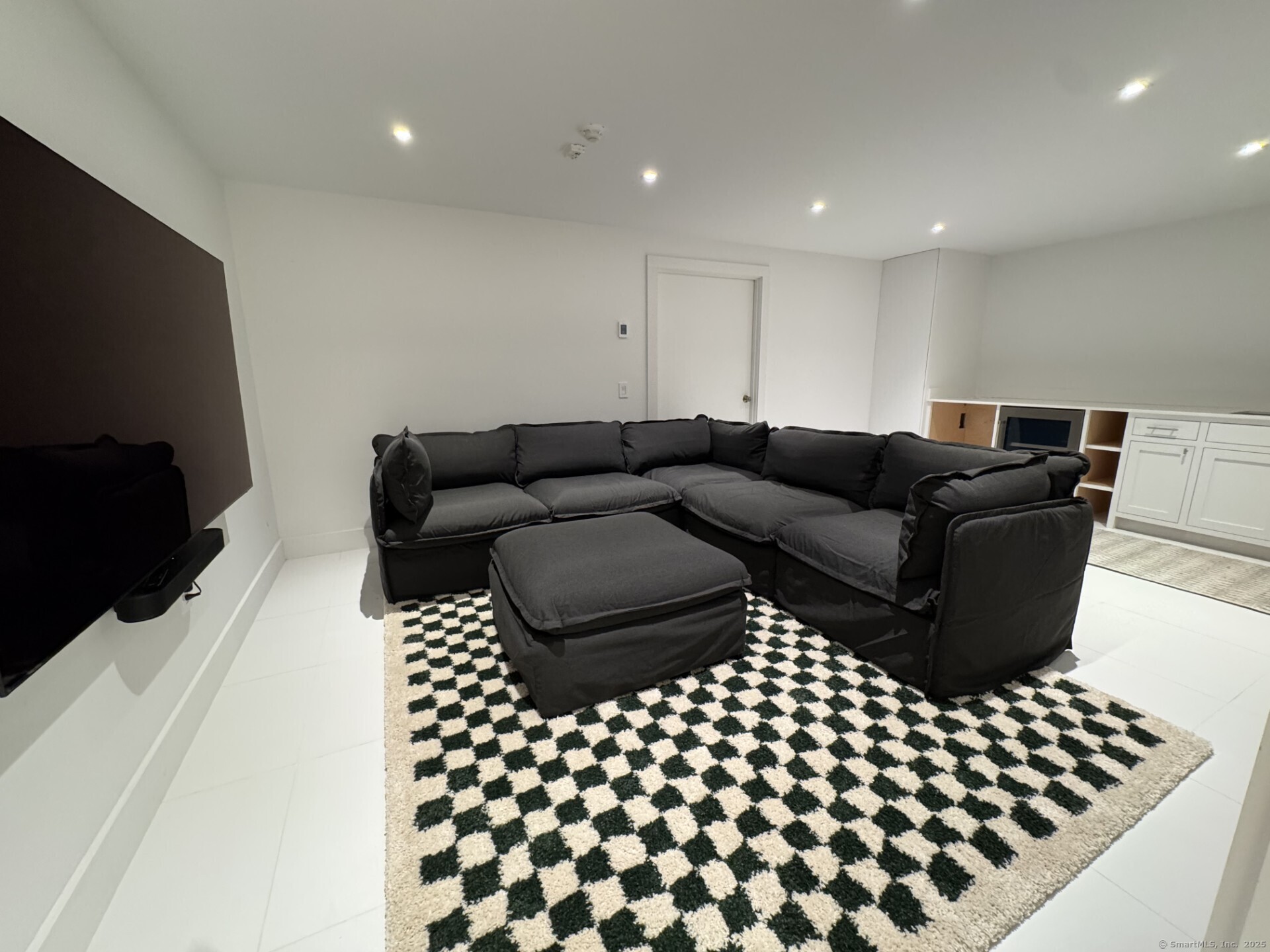 24 Old Roxbury Road Roxbury, CT 06783 - Photo 37 of 38 a living room with a couch and a black white checkered floor