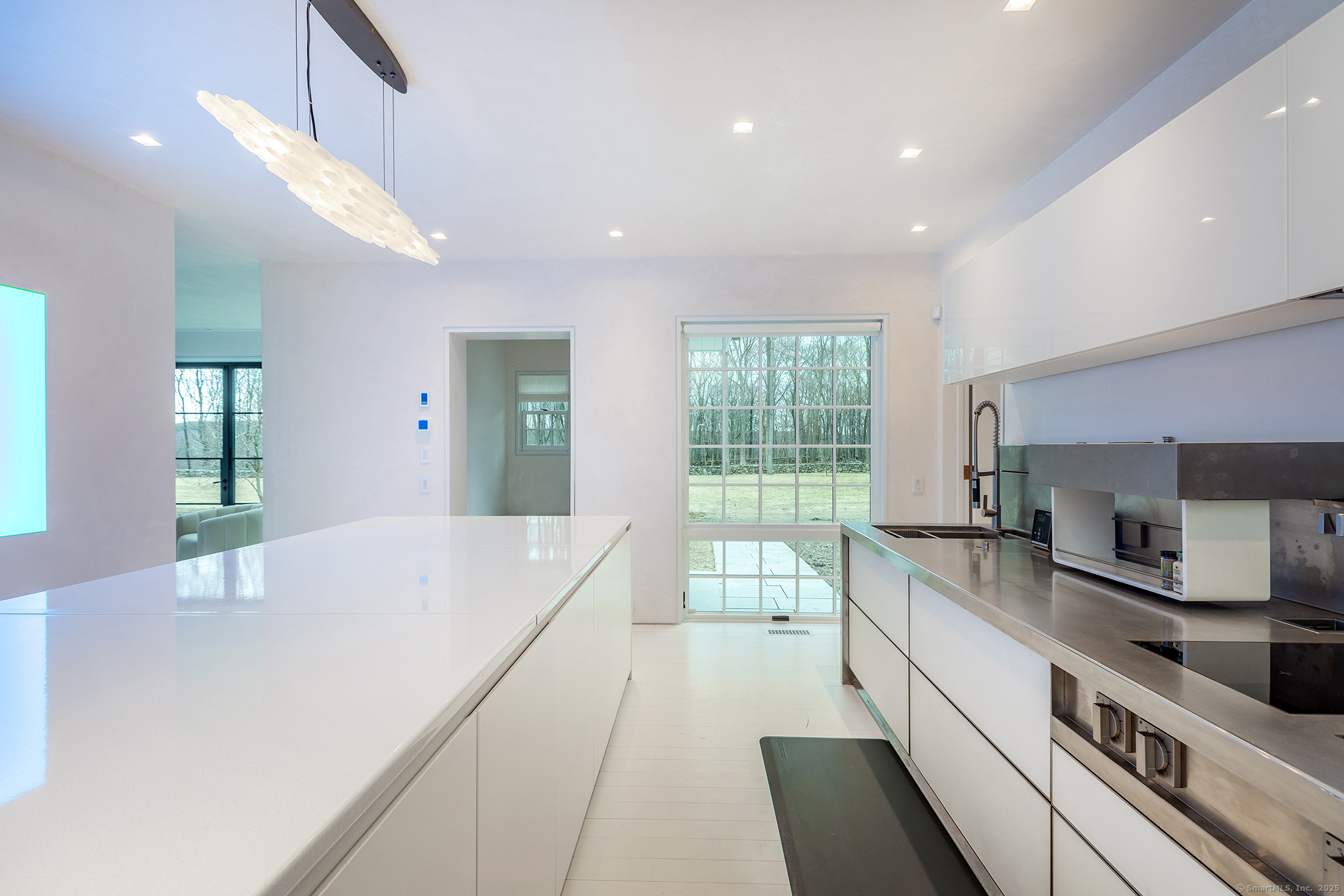 24 Old Roxbury Road Roxbury, CT 06783 - Photo 6 of 38 a large kitchen with stainless steel appliances a large counter top a stove a chimney a sink and dishwasher