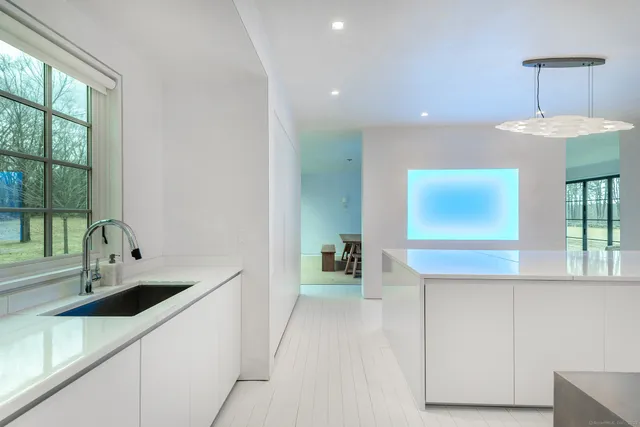 a kitchen with sink and cabinets