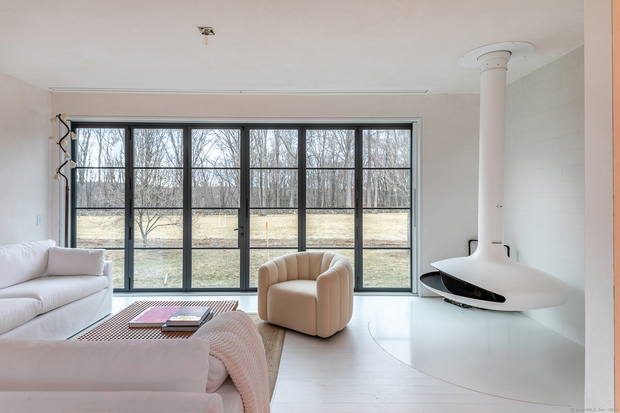 24 Old Roxbury Road Roxbury, CT 06783 - Photo 10 of 38 a living room with furniture and a large window