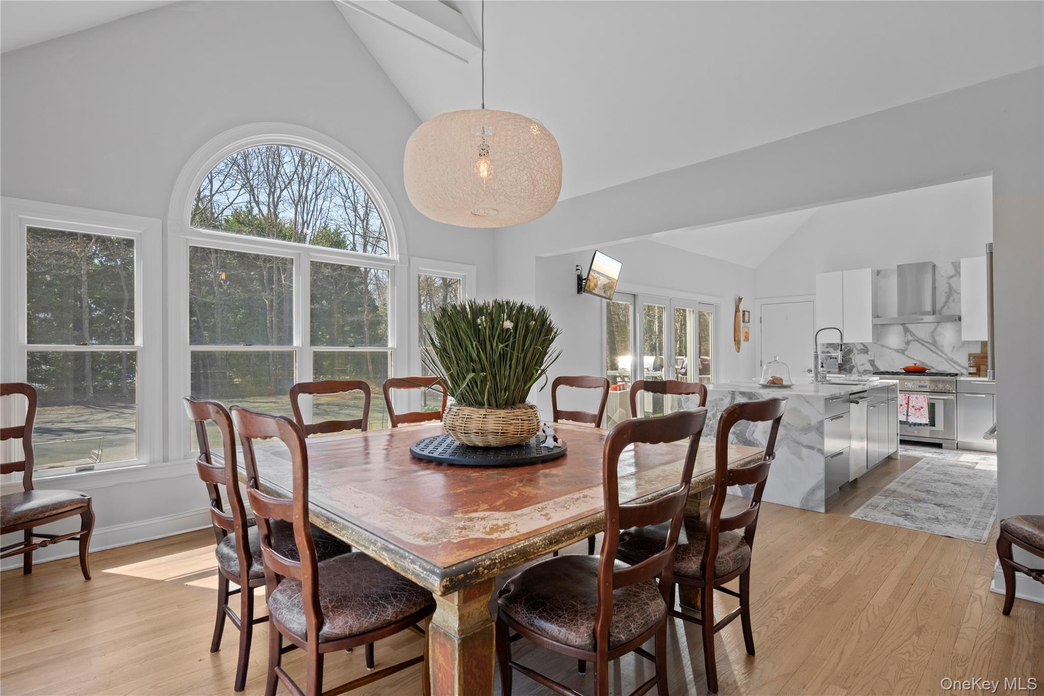 38 Pheasant Run Quogue, NY 11959 - Photo 13 of 35 a view of a dining room with furniture window and wooden floor
