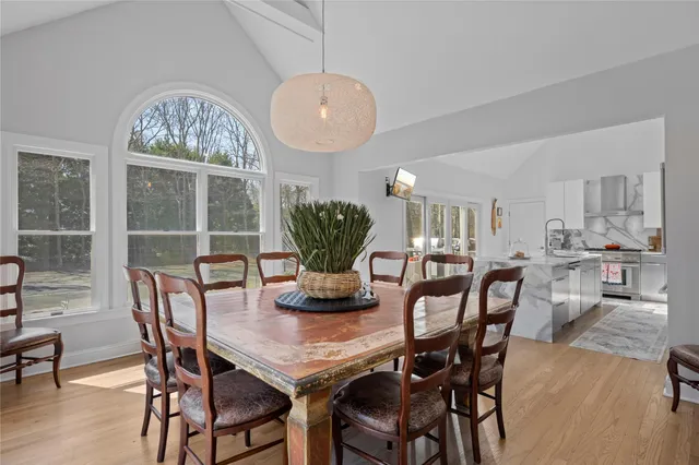 a view of a dining room with furniture window and wooden floor