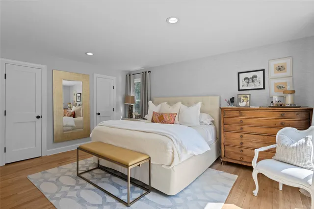 a bedroom with a bed and a dresser