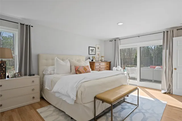 a bed room with a bed and a chair