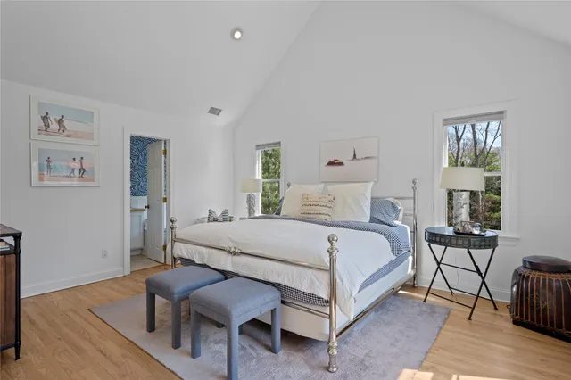 a bedroom with a bed a table and chair