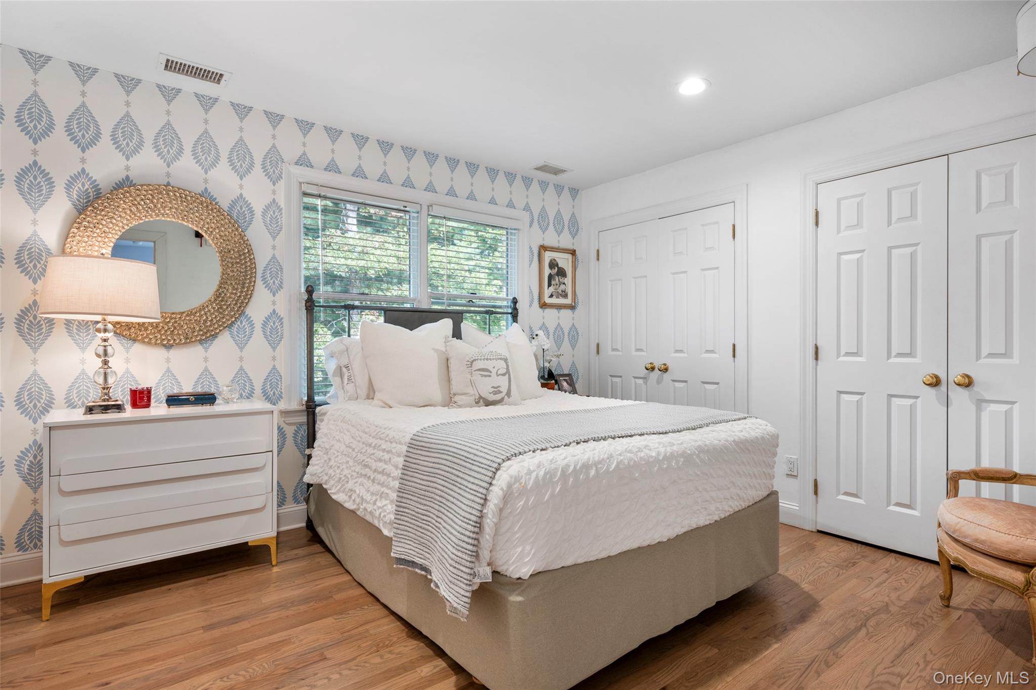 38 Pheasant Run Quogue, NY 11959 - Photo 21 of 35 a bedroom with bed and a large window