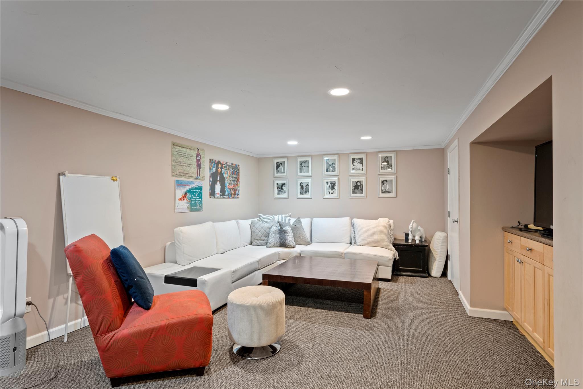 38 Pheasant Run Quogue, NY 11959 - Photo 28 of 35 a bedroom with furniture and a couch
