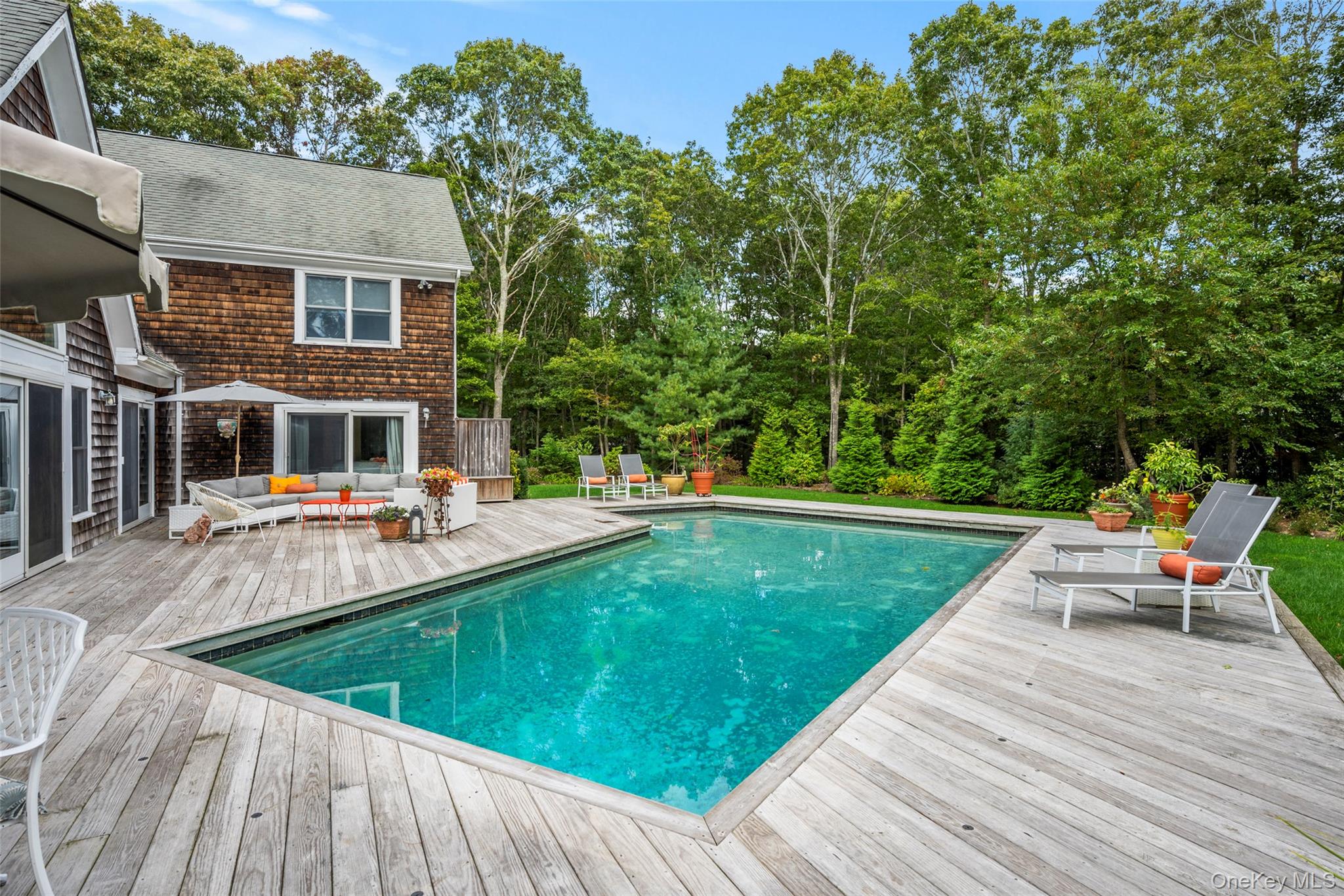 38 Pheasant Run Quogue, NY 11959 - Photo 30 of 35 swimming pool view with a seating space