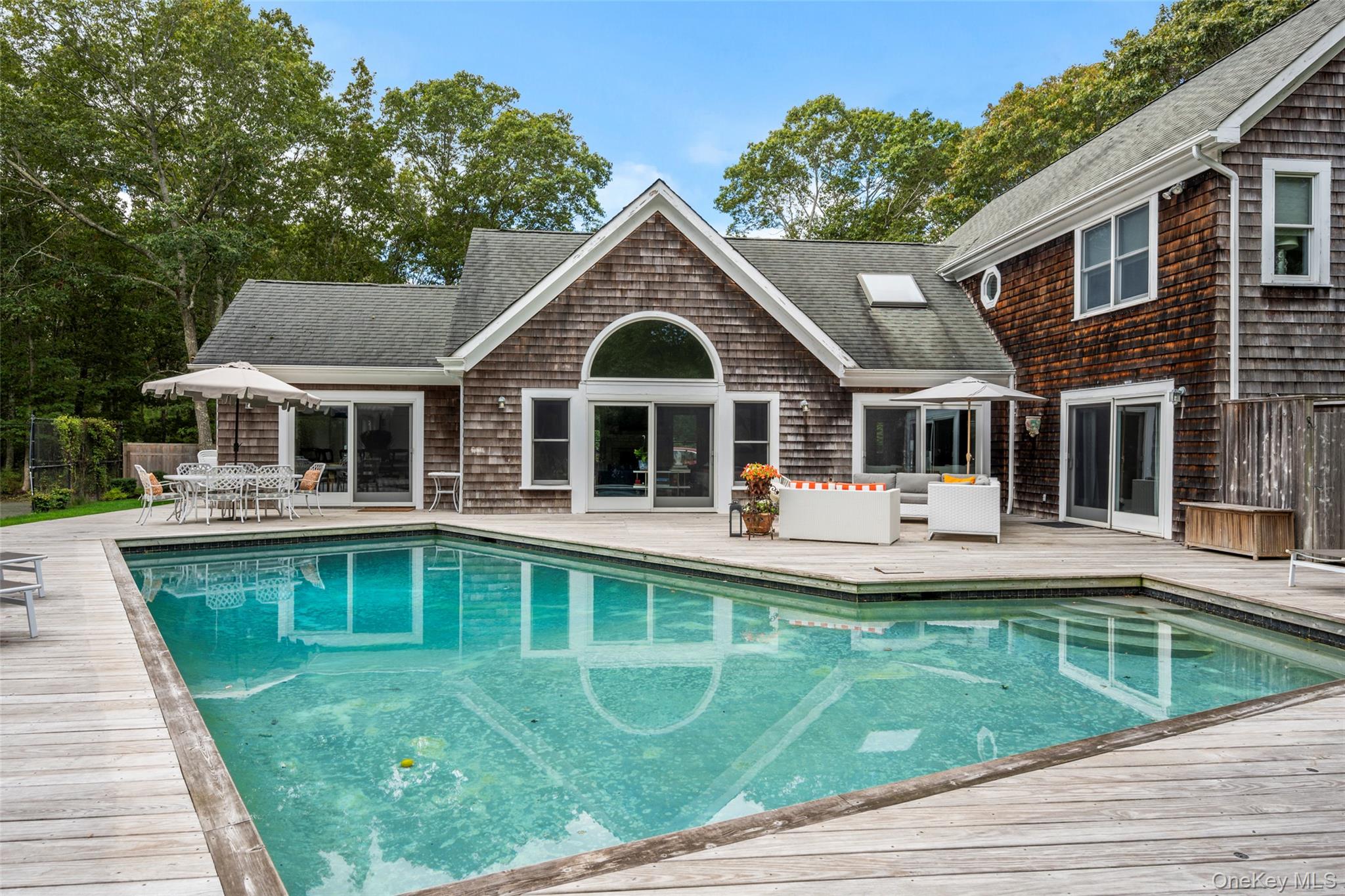 38 Pheasant Run Quogue, NY 11959 - Photo 31 of 35 a view of a house with a swimming pool