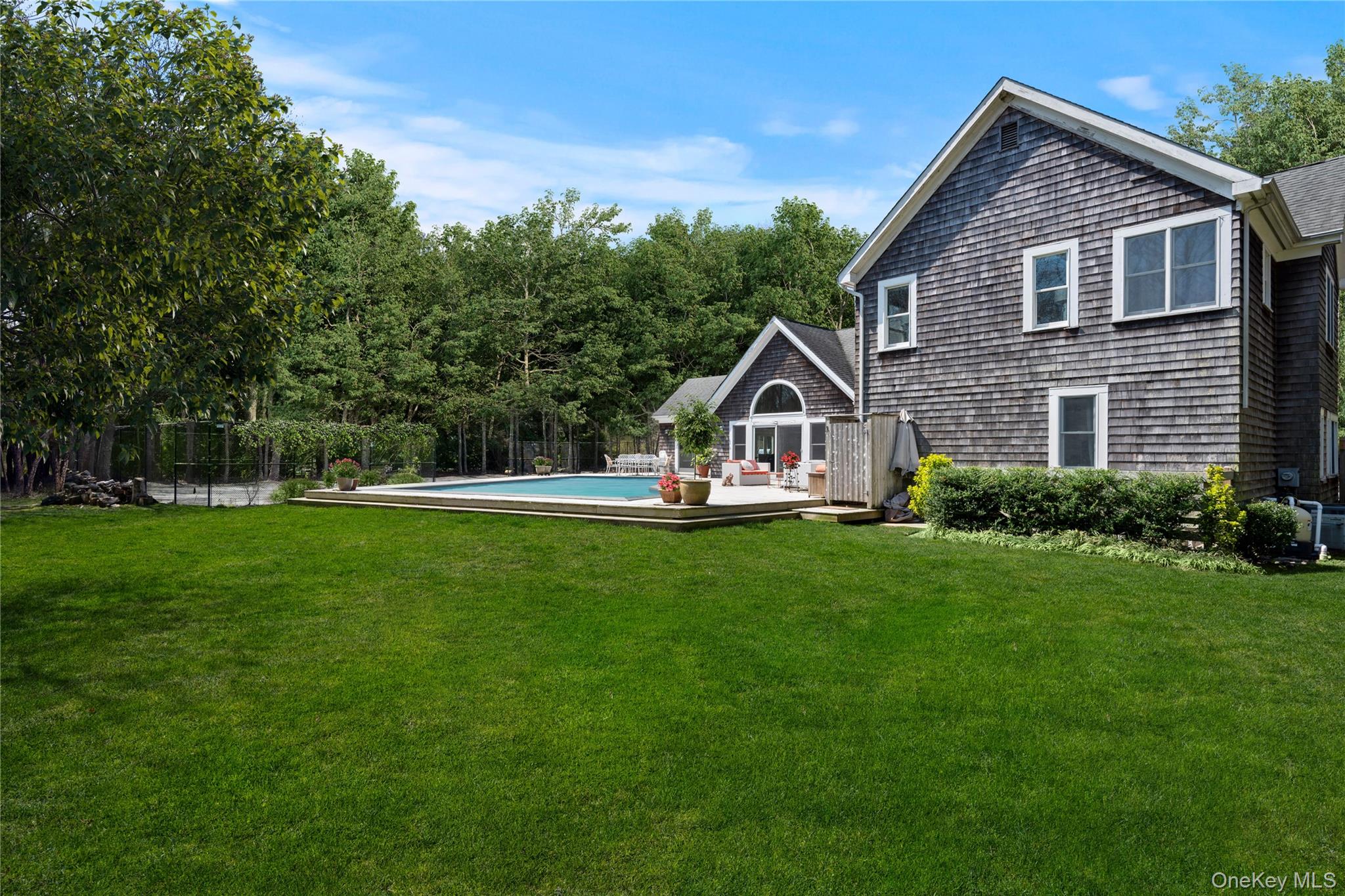 38 Pheasant Run Quogue, NY 11959 - Photo 35 of 35 a view of house with garden