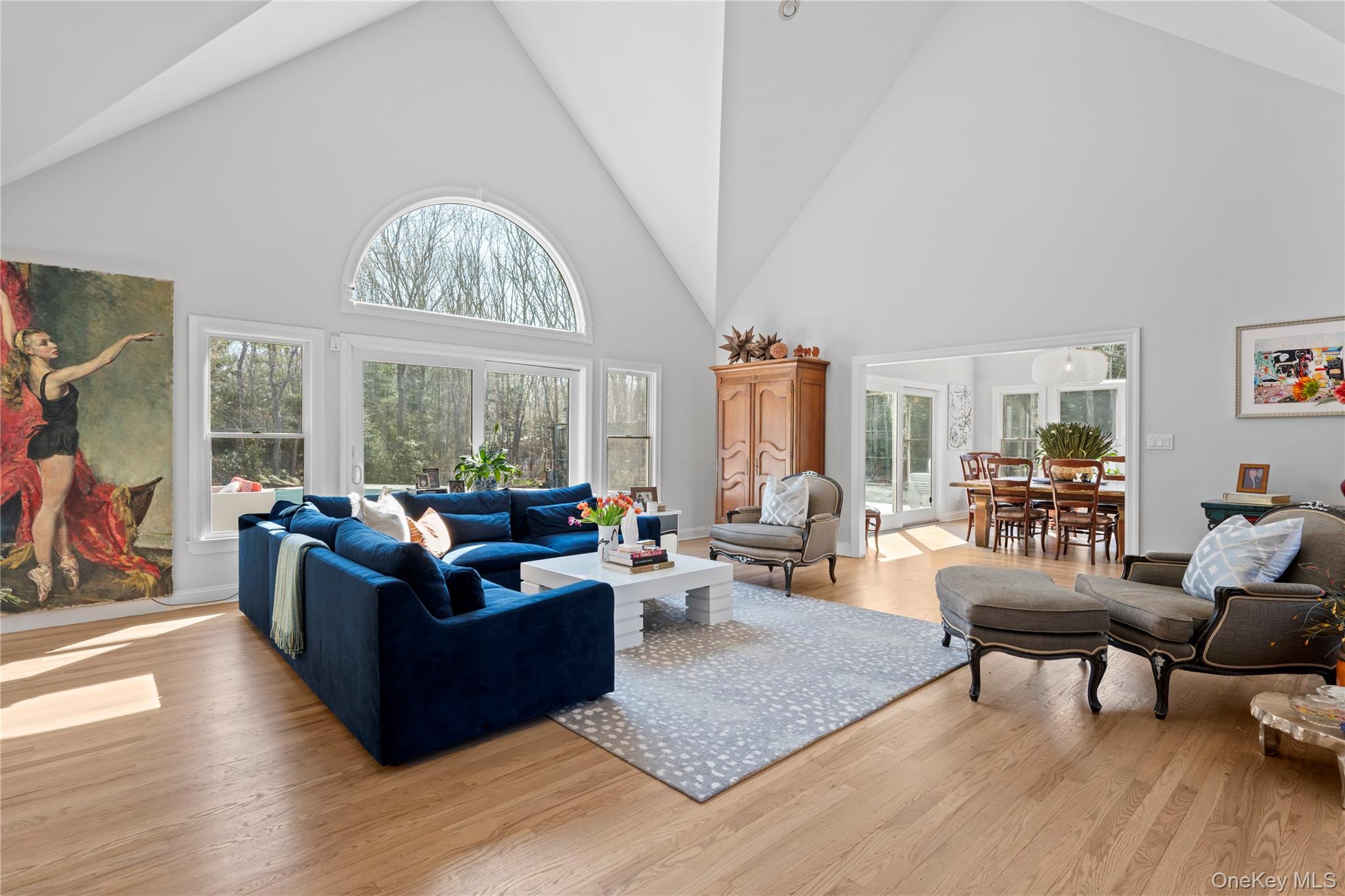 38 Pheasant Run Quogue, NY 11959 - Photo 7 of 35 a living room with furniture a fireplace and large windows