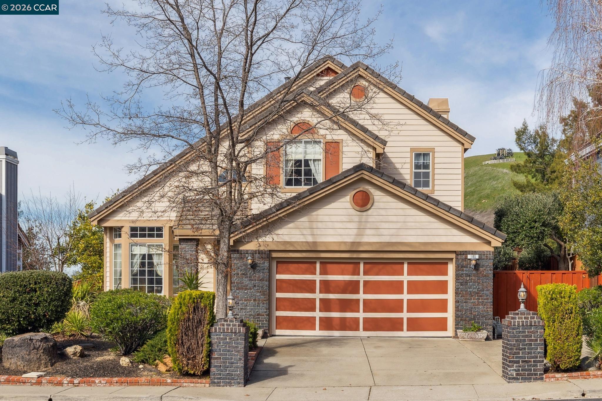 a front view of a house with a garage