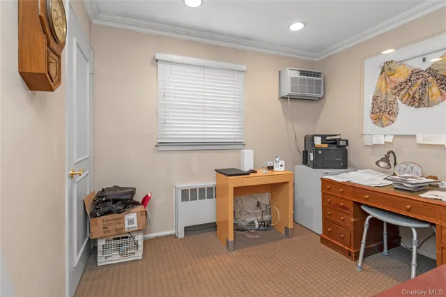 a workspace with furniture and window