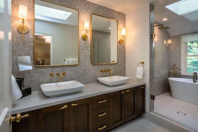 a white bath tub sitting next to a white toilet