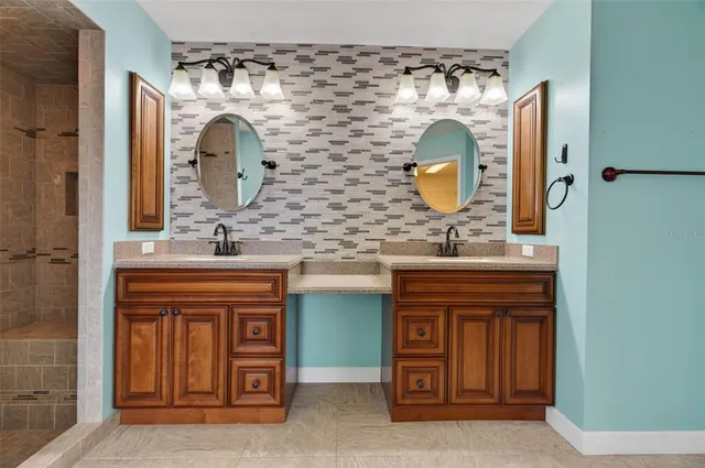 a bathroom with a sink and a mirror