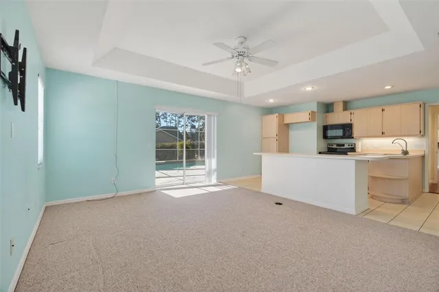 a view of a kitchen with microwave and cabinets