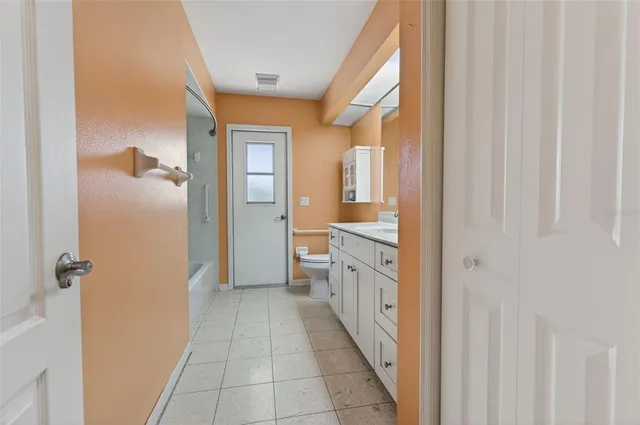 a bathroom with a sink a mirror and a shower
